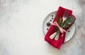 Christmas table place setting. Tableware with evergreen twigs, co
