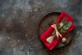 Christmas table place setting. Tableware with evergreen twigs, co