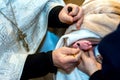 Chrismation sacrament of newborn baby during christening Royalty Free Stock Photo