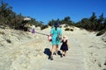 A mother and a daughter are walking around Chrissi island, Greece