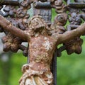 Christ on the cast- iron cross in the old cemetery Royalty Free Stock Photo