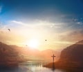 Christ Jesus birth and resurrection concept :Silhouette cross on Calvary mountain sunset background Royalty Free Stock Photo