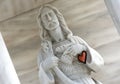 Christ with an orange heart on his wrist Royalty Free Stock Photo