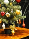 Tree Christ`s Mass Christmas Trimmings Decoration Gift box Colored balls Snow Globe bell Nutcracker Lights Royalty Free Stock Photo