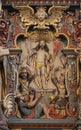 Christ with the victory banner and other symbols on a wood carving