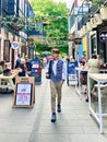 Christchurch, New Zealand - Feb 02 2024: A young man explores Christchurch\'s vibrant Riverside Market Royalty Free Stock Photo