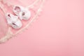 Christening background with baptism baby shoes on pink background