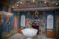 Christening bath and the altar at the orthodox church during christening