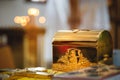 Christening in the church, golden religious utensils: bible, cross, prayer book, missal. Details in the orthodox christian church Royalty Free Stock Photo