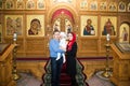 Christening. Family celebrating baptism in Orthodox Church