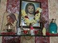 A Christian Alter. Images of Jesus and Mother mary with a garland of flowers.