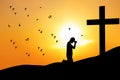 Christian background: man praying under the cross Royalty Free Stock Photo