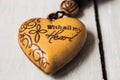 christian charm with message on wooden background