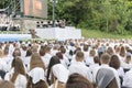 Christian choir of young men and girls in the park sing Christian songs and glorify God