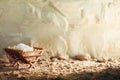 Christian Christmas concept. Birth of Jesus Christ. Wooden manger in cave background. Banner, copy space. Nativity scene Royalty Free Stock Photo