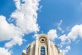 Christian church against the blue sky with clouds background. Background Royalty Free Stock Photo
