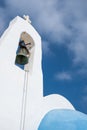 Christian church with belfry dome against blue cloudy sky