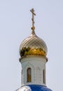 christian church with a dome and a cross without people against a blue sky Royalty Free Stock Photo