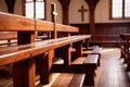 Christian church interior background with wooden furniture and cross