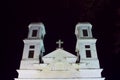 Christian classical white church towers at night