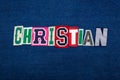 CHRISTIAN collage of word text, multi colored fabric on blue denim, Christianity religion diversity concept