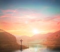 Silhouette cross on Calvary mountain sunset background. Easter concept