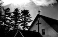 Christian cross against an ominous grey sky