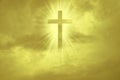 Christian cross appears bright in the yellow sky Royalty Free Stock Photo