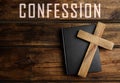 Christian cross, Bible and word Confession on wooden background, top view Royalty Free Stock Photo