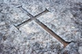 Christian cross engraved in marble tombstone in a graveyard Royalty Free Stock Photo