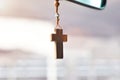 Christian cross hangs on the mirror in the car. Royalty Free Stock Photo