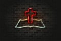 Christian cross and holy bible glowing neon sign or glass tube on a black brick wall. Realistic vector art Royalty Free Stock Photo