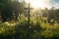 Christian cross lies on the green grass, sun rays, Royalty Free Stock Photo