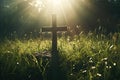 Christian cross lies on the green grass, sun rays, Royalty Free Stock Photo