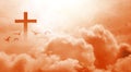 The Christian cross looks bright in the golden sky, with soft white clouds and beautiful light which leads to peace and heaven. Royalty Free Stock Photo