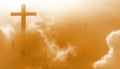 The Christian cross looks bright in the golden sky, with soft white clouds and beautiful light which leads to peace and heaven. Royalty Free Stock Photo