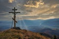 Christian cross on the mountain top at the sunset Royalty Free Stock Photo