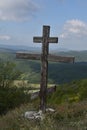 Christian cross in nature, Orthodox cross on the mountain, in the mountains stands a cross for Christians
