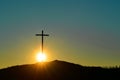 Christian cross over beautiful sunset background, concept of spirituality Royalty Free Stock Photo