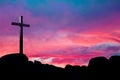 Christian cross over beautiful sunset background Royalty Free Stock Photo