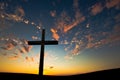 Christian cross over beautiful sunset background