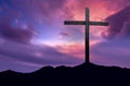 Christian cross over dark sunset background Royalty Free Stock Photo