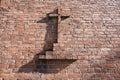 Christian cross on red brick wall Royalty Free Stock Photo