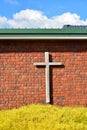 Christian cross on red brick wall Royalty Free Stock Photo