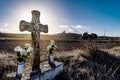 Christian cross in a roadside ditch