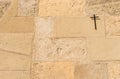 Christian cross on stone wall background with religious symbol Royalty Free Stock Photo