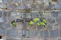 A Christian cross on the stone wall at Ephesus near Selcuk in Turkey. Royalty Free Stock Photo