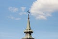 Christian cross at the top of a steeple church tower, typical Austro Hungarian baroque style of an Orthodox church of Serbia