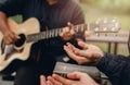 Christian Families Worshiping God Outdoors To relax life honoring God with a melodious guitar playing bible