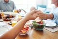 Christian, family and pray for food holding hands for lunch together at home dining table. Faith, gratitude and prayer